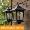 Outdoor Solar Wall Lanterns (2-Pack) - Anti-Rust Metal Hanging Solar Sconces with 4 Solar Panels, 3000K Warm White Dusk to Dawn LED Glass Bulb Lights for Porch, Patio, and Garage